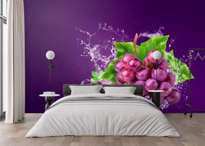 Water splashing on Fresh Red Grapes over red background. Wall mural