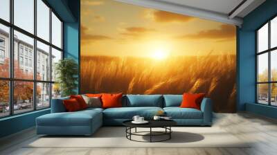 A dramatic sunset casting long shadows over a field of tall grass. The golden light and the swaying grass create a warm and tranquil evening atmosphere. Wall mural