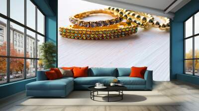 a lot of gold costume jewelry with different materials on a white background Wall mural