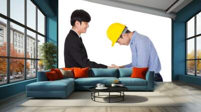 The young engineer in yellow helmet shaking hand with his boss. The handsome CEO hold co worker hand to thank you for complete new project. Portrait of business concept on isolated white background. Wall mural