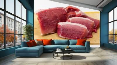 raw pork on the Board on a white background Wall mural