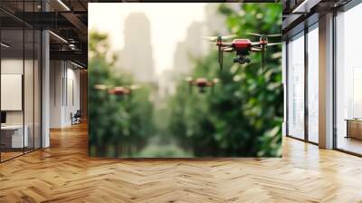 A group of red drones flying through a green, tree-lined urban park with tall buildings in the background, ideal for illustrating concepts of modern technology, aerial surveillance Wall mural