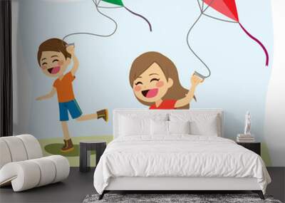 Cute young children friends playing and flying colorful kite over blue sky Wall mural