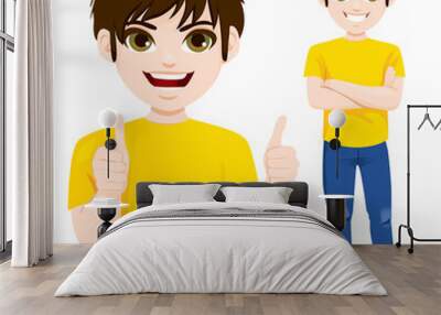 Teenager boy standing with arms crossed and making thumbs up hand sign gesture closeup Wall mural