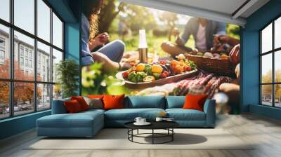 A group of friends having a picnic with healthy food options.  Wall mural