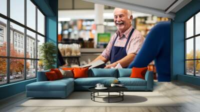 A happy supermarket cashier at work Wall mural