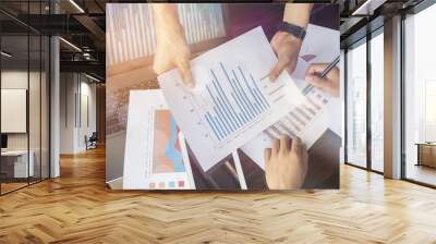 Hands of businesspeople during data discussion at meeting Wall mural