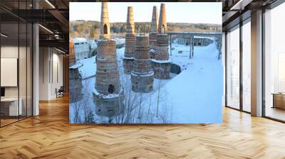 Remains of an abandoned marble and lime factory in Ruskeala, Republic of Karelia, Russia. Tall brick chimneys in the winter season Wall mural