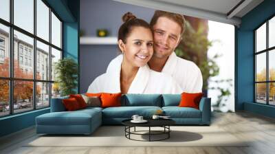 Adult happy couple relaxing in spa salon Wall mural