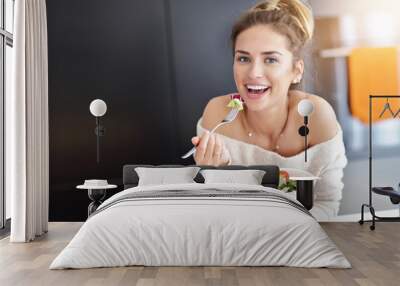 Beautiful Smiling Woman Eating Fresh Organic Vegetarian Salad In Modern Kitchen Wall mural