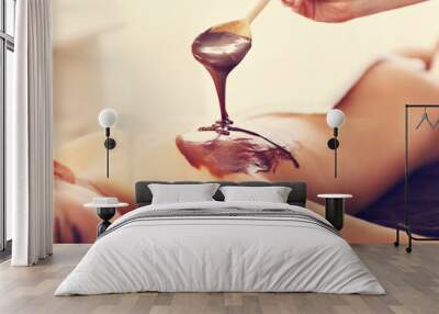 Beautiful woman getting chocolate massage in spa Wall mural