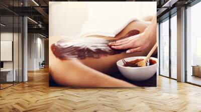 Beautiful woman getting chocolate massage in spa Wall mural