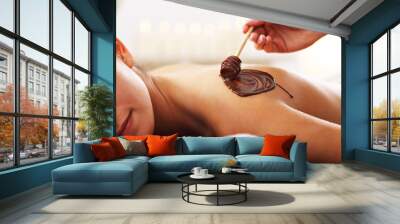 Beautiful woman getting chocolate massage in spa Wall mural