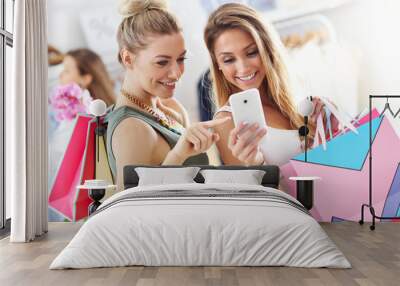 Group of happy friends shopping in store Wall mural