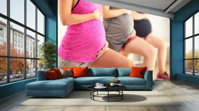 Group of pregnant women during fitness class Wall mural