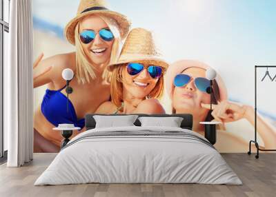 Group of women having fun on the beach Wall mural