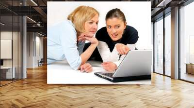 mother and daughter using laptop over white background Wall mural