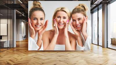 Picture showing group of happy friends in spa Wall mural