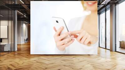 Woman with smartphone Wall mural