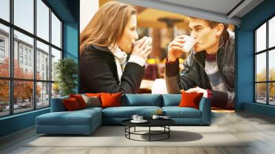 Young couple drinking coffee Wall mural