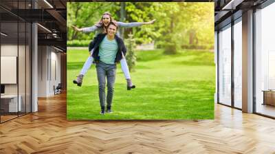 Young couple strolling in the park Wall mural