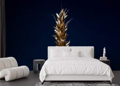 Golden rye ear on dark blue background Wall mural