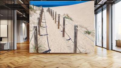 Wooden board path way to the sandy beach Wall mural