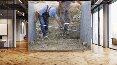 builder worker with measuring tape 2 Wall mural