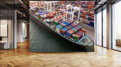 Aerial view Container ship at industrial port in import export business logistic and transportation of international by container ship, Container loading in cargo freight ship industrial crane. Wall mural