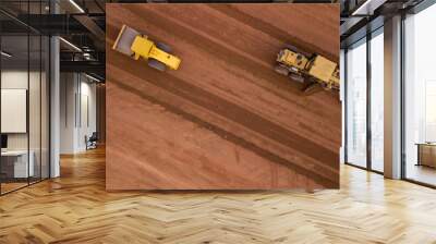 Aerial view yellow excavator building a highway, Road grader heavy earth moving, Bulldozer working at road construction. Wall mural