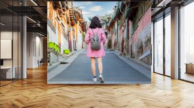 Asian traveler travel at traditional Korean style architecture at Bukchon Hanok Village in Seoul, South Korea, Bukchon Hanok Village in Seoul, South Korea. Wall mural