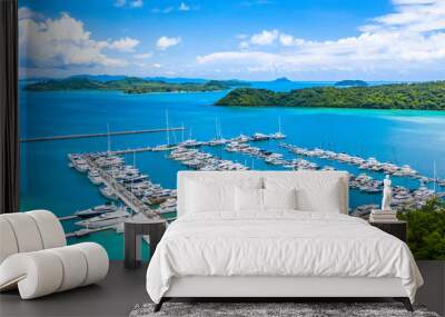 Beautiful port yachts and boats in marina bay, Aerial view of yachts and boat in the marina clear water with blue sky background. Wall mural