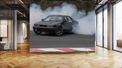 Car drifting with smoke, motion blur drifting car. Wall mural