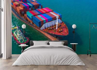 Container ship arriving in port, Tug boat and container ship going to deep sea port, logistic business import export shipping and transportation, Aerial view. Wall mural