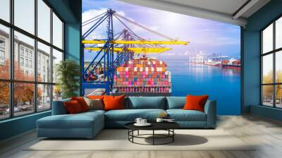 Container ship at industrial port loading and unloading containers in import export commercial business logistic and transportation of international by container cargo ship boat in the open sea. Wall mural