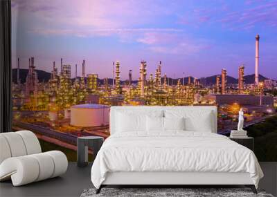 Oil​ refinery​ with oil storage tank and petrochemical​ plant industrial background at twilight, Aerial view oil and gas refinery at twilight. Wall mural