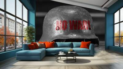 Black and white photo of metal military helmet with the inscription No war on black background. NO War concepts. Wall mural