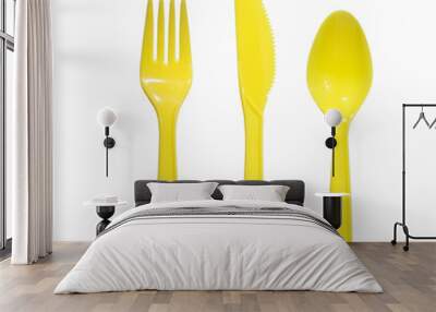 vibrant yellow plastic fork, knife and spoon Wall mural