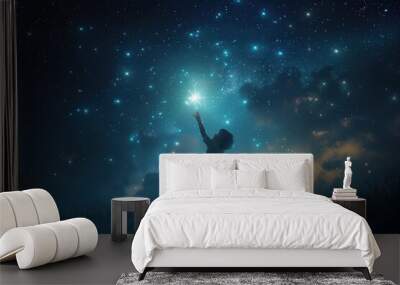 Silhouette of a child reaching for a star Wall mural