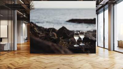 Two glasses of white vine on stones Wall mural