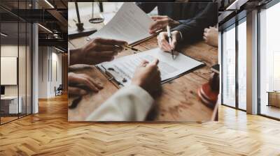 Business people negotiating a contract, discussing contract while working together in sunny modern office, unknown businessman and woman with colleagues or lawyers at meeting. Wall mural