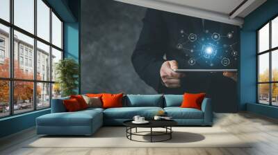 Businessman holding a tablet, hologram icon online data network connection, uploading data to cloud so that data can be transferred to other devices and can view data online at any time. Wall mural