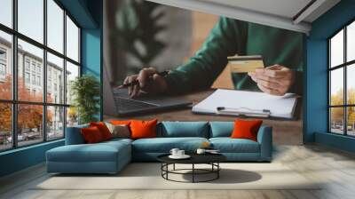 Individuals hold credit cards, pay for goods and services by credit card, make purchases on online shopping sites and make payments via credit card or cash on delivery. Online shopping concept. Wall mural