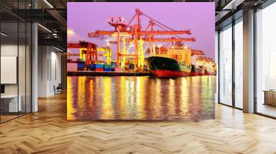 container cargo freight ship with working crane bridge in shipya Wall mural