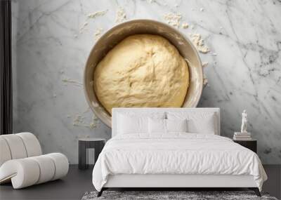 The pizza dough resting in a bowl, doubled in size after rising, ready to be shaped Wall mural