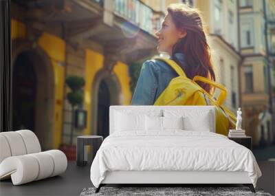 women with yellow travel bag with the anticipation and excitement of checking into a hotel for a long-awaited Wall mural