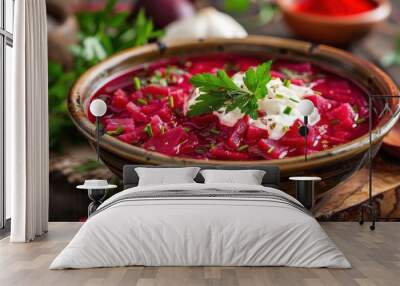 A vibrant bowl of borscht topped with sour cream and fresh herbs, showcasing traditional Eastern European cuisine. Wall mural