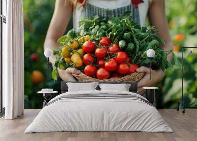 A woman holding a basket of fresh, colorful tomatoes and leafy greens in a vibrant garden, symbolizing organic farming and healthy eating. Wall mural