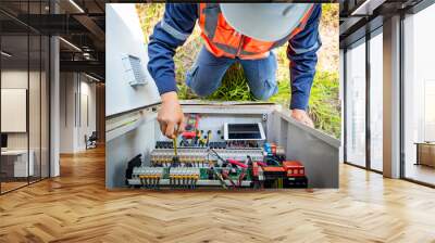 The solar farm(solar panel) with engineers check the operation of the system, Alternative energy to conserve the world's energy, Photovoltaic module idea for clean energy production Wall mural