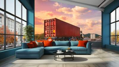 Truck with red container on the highway with sunset time, logistic import export and transport industry concept Wall mural